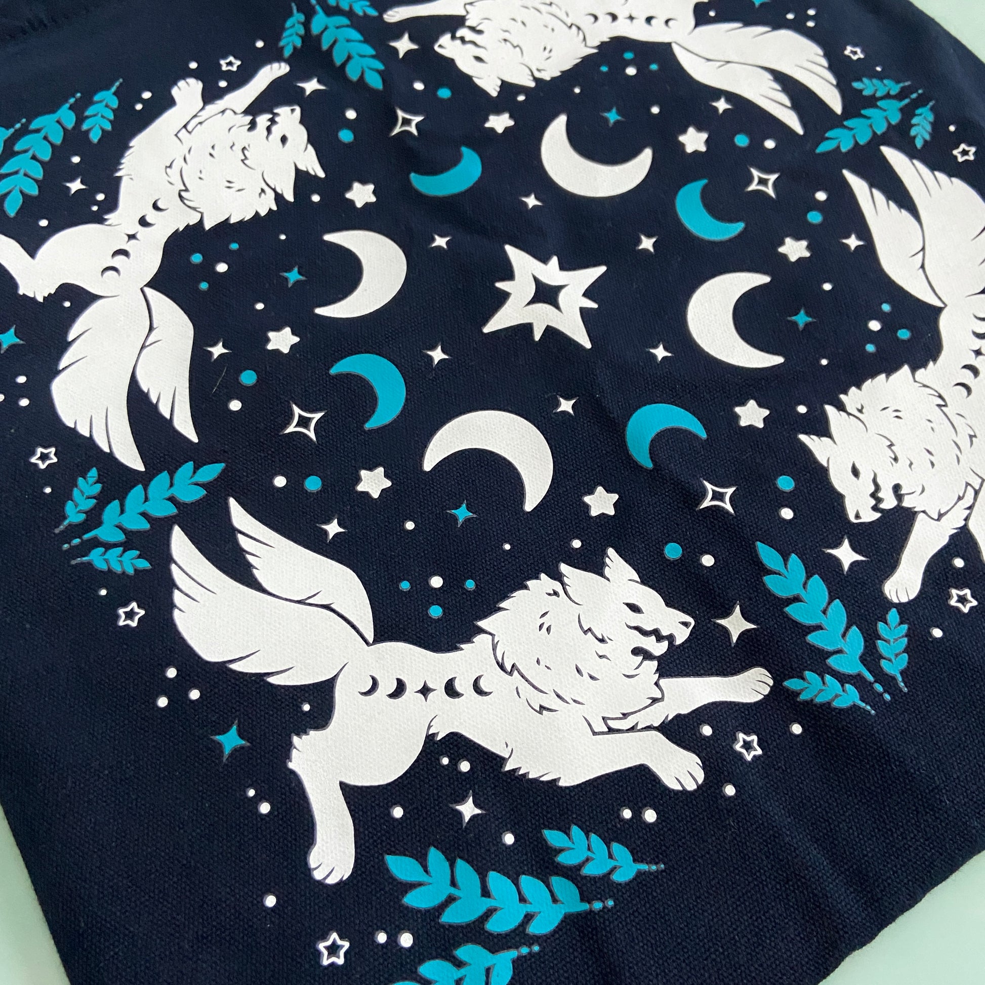 https://www.sleepingwolvesart.com/cdn/shop/products/NAVYWolfTote1.jpg?v=1637959842&width=1946